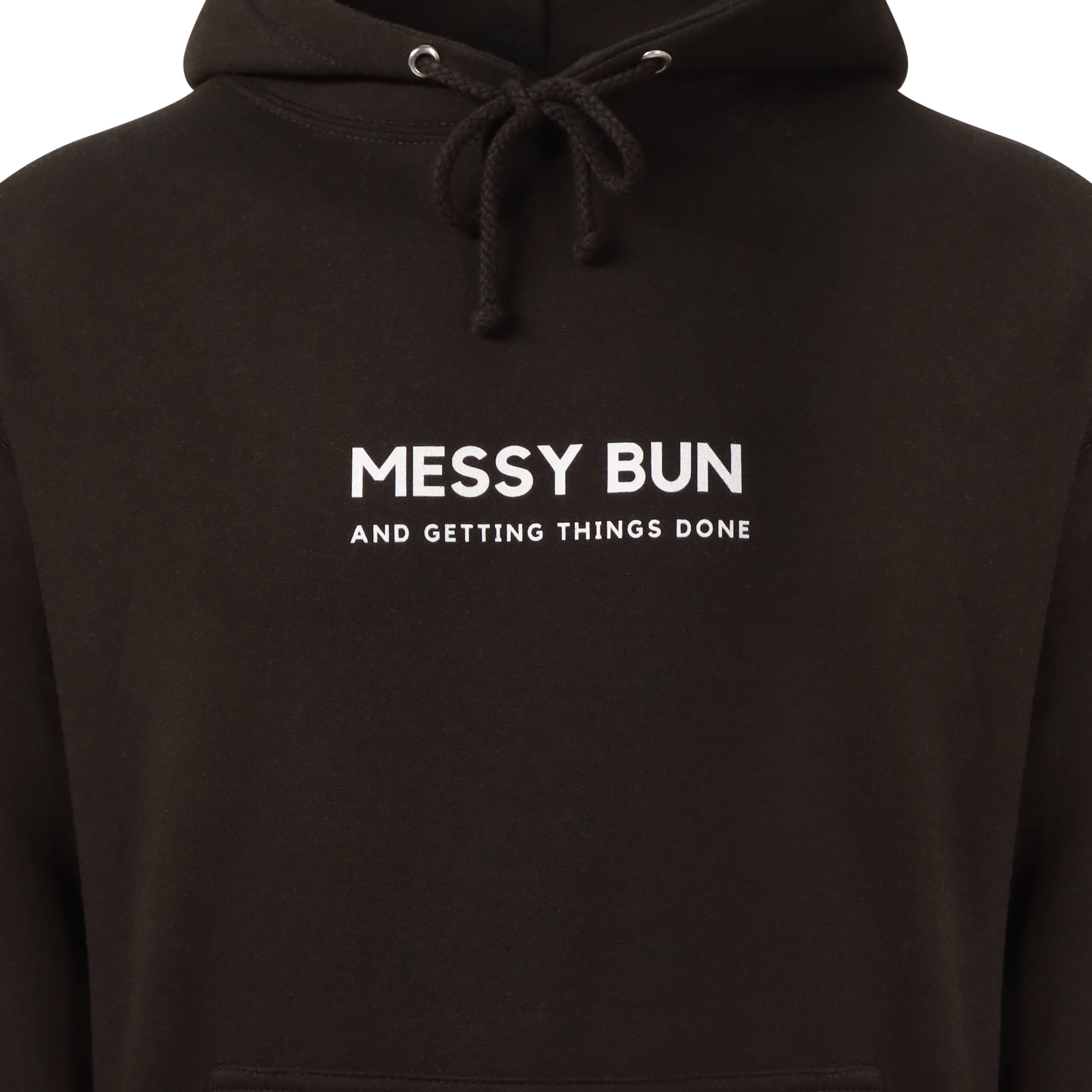 Black hoody that reads: Messy bun and getting things done in white text. Text is in a sans font all caps, messy bun is written bigger than getting things done