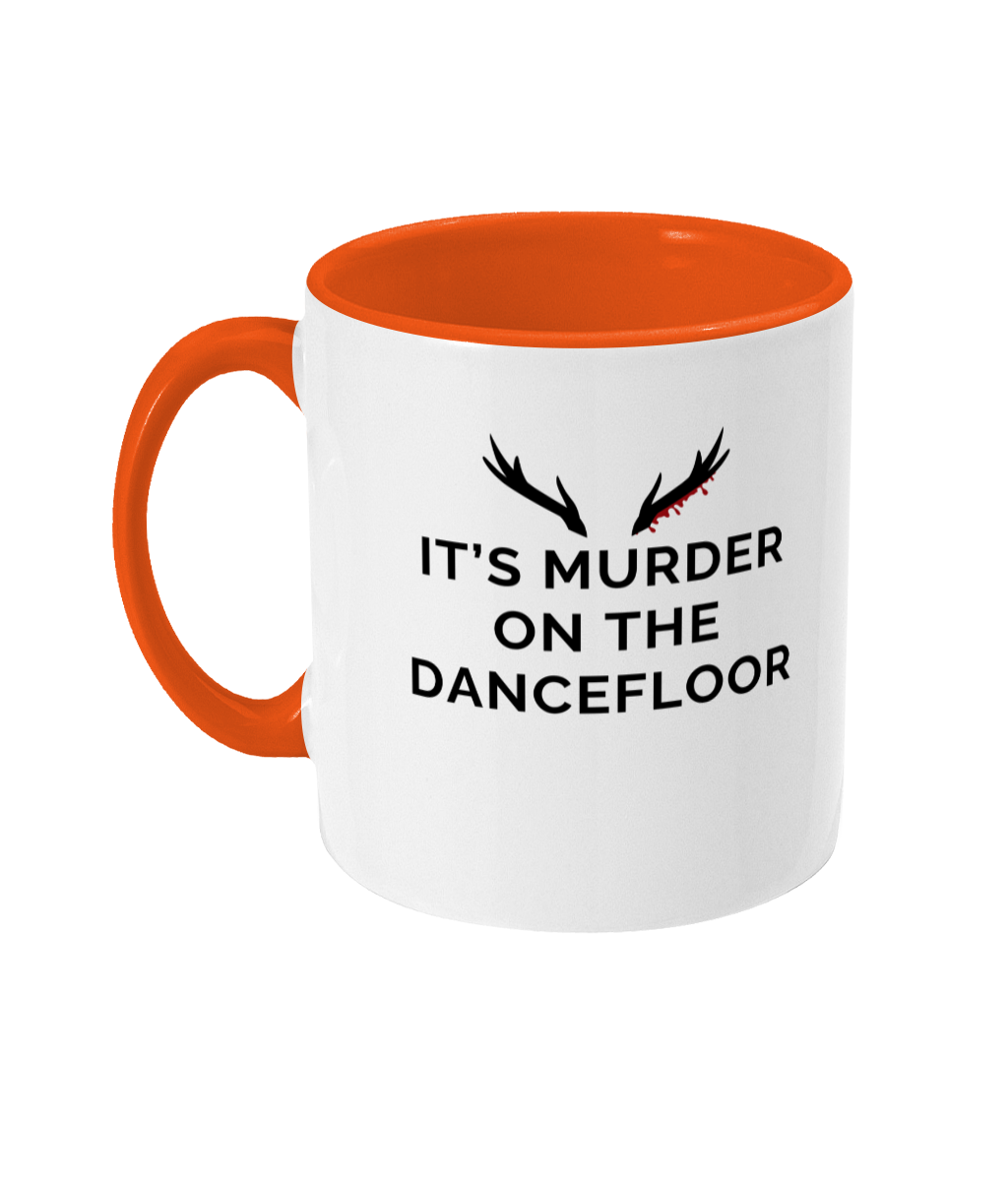 Mug with a orange handle and orange inner that reads "It's Murder On The Dancefloor" with antlers above the text with blood drips coming from the right bottom antler