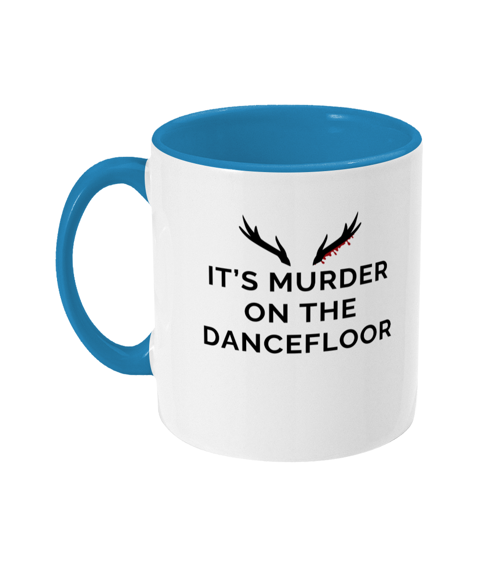 Mug with a blue handle and blue inner that reads "It's Murder On The Dancefloor" with antlers above the text with blood drips coming from the right bottom antler