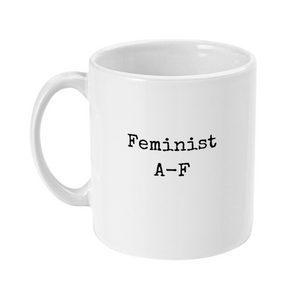 Mug with text on in typewriter style font saying: Feminist A-F