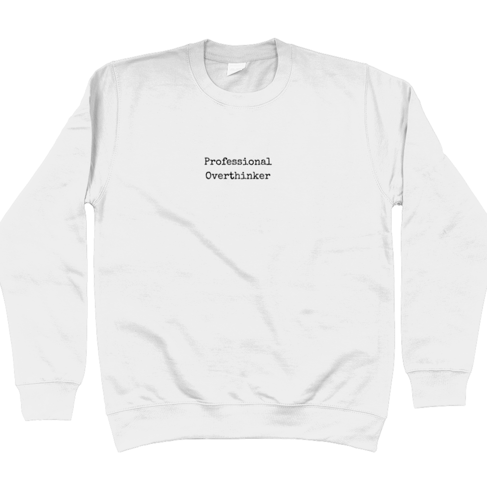 Sweatshirt in arctic white with black text in typewriter font that says: Professional Overthinker. Text is in the middle of the chest and small in size