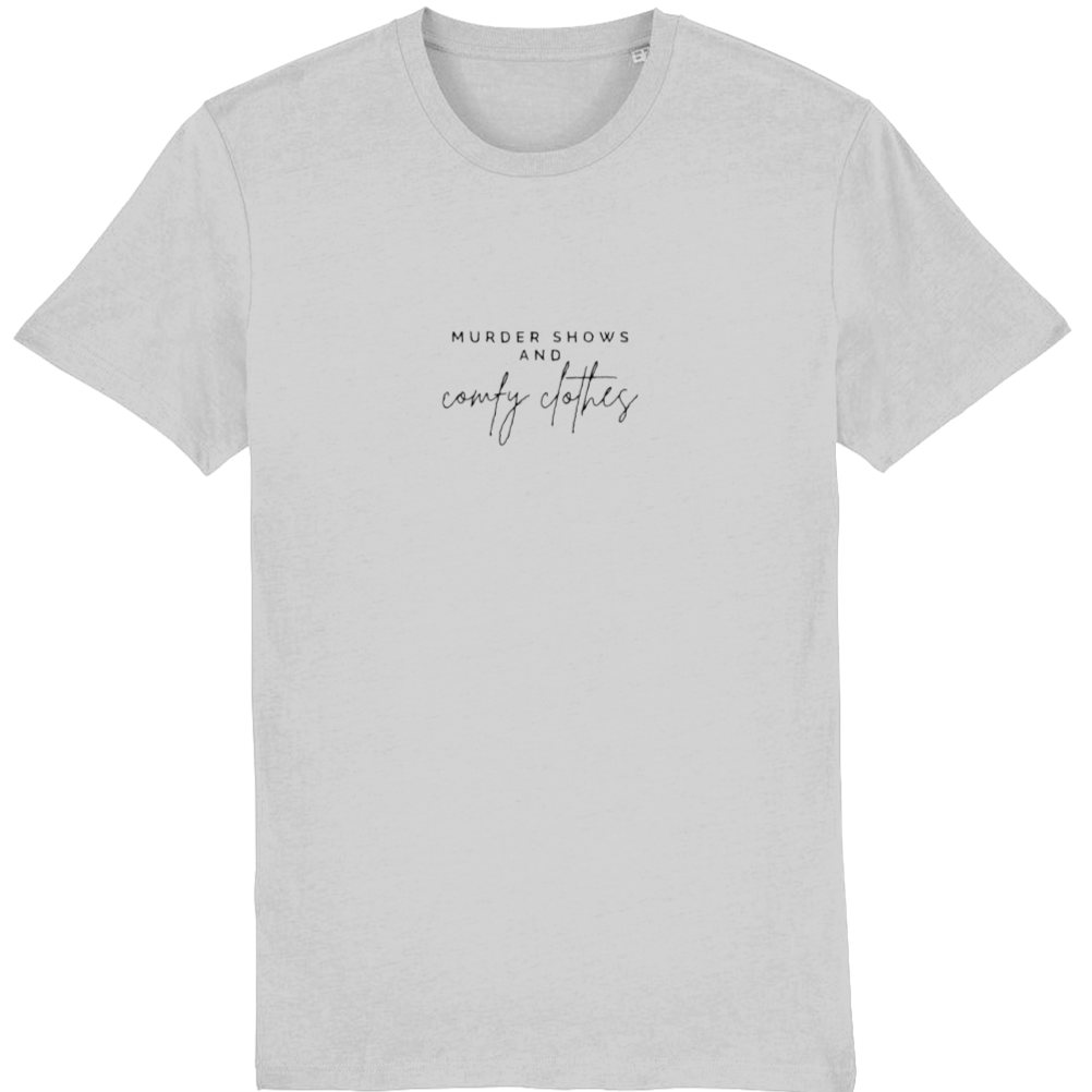 Heather grey Organic T-Shirt that says: Murder shows and comfy clothes. Murder shows is in all caps in a serif font, and comfy clothes is in a handwriting style font 