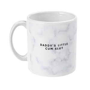 Mug with a marble print on that says daddy's little cum slut