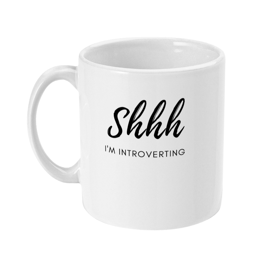 Mug that says: Shhh I'm introverting. Shhh is in large script text, and I'm introverting is in small sans serif text underneath