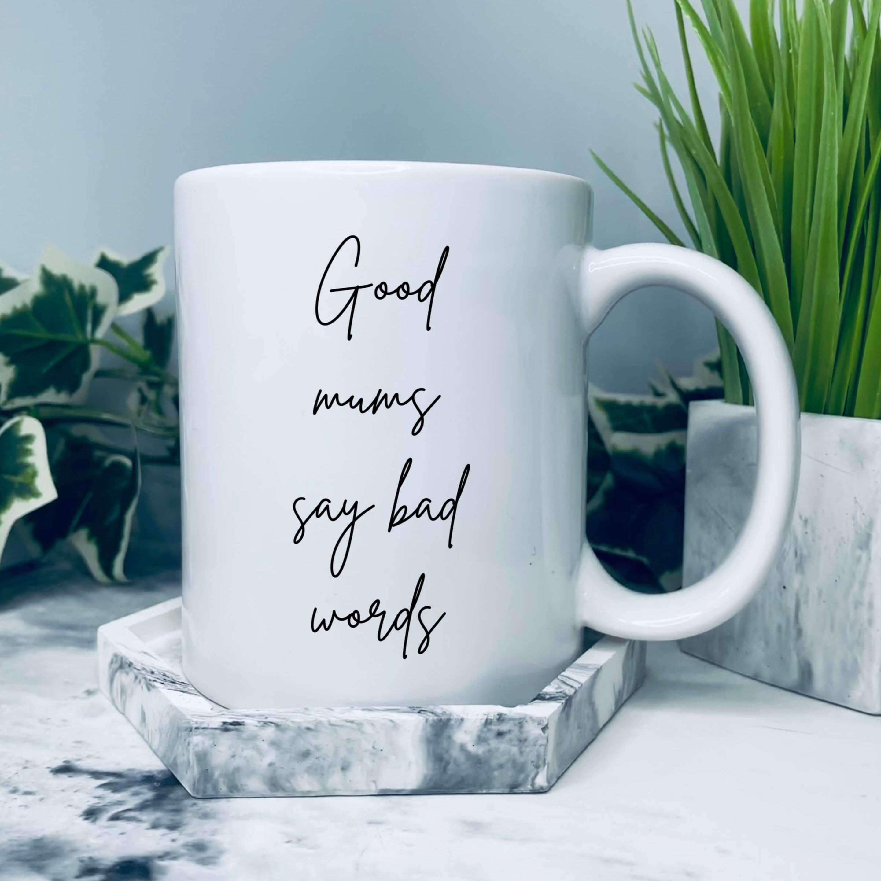 Mug with text in a handwriting style that says: good mums say bad words