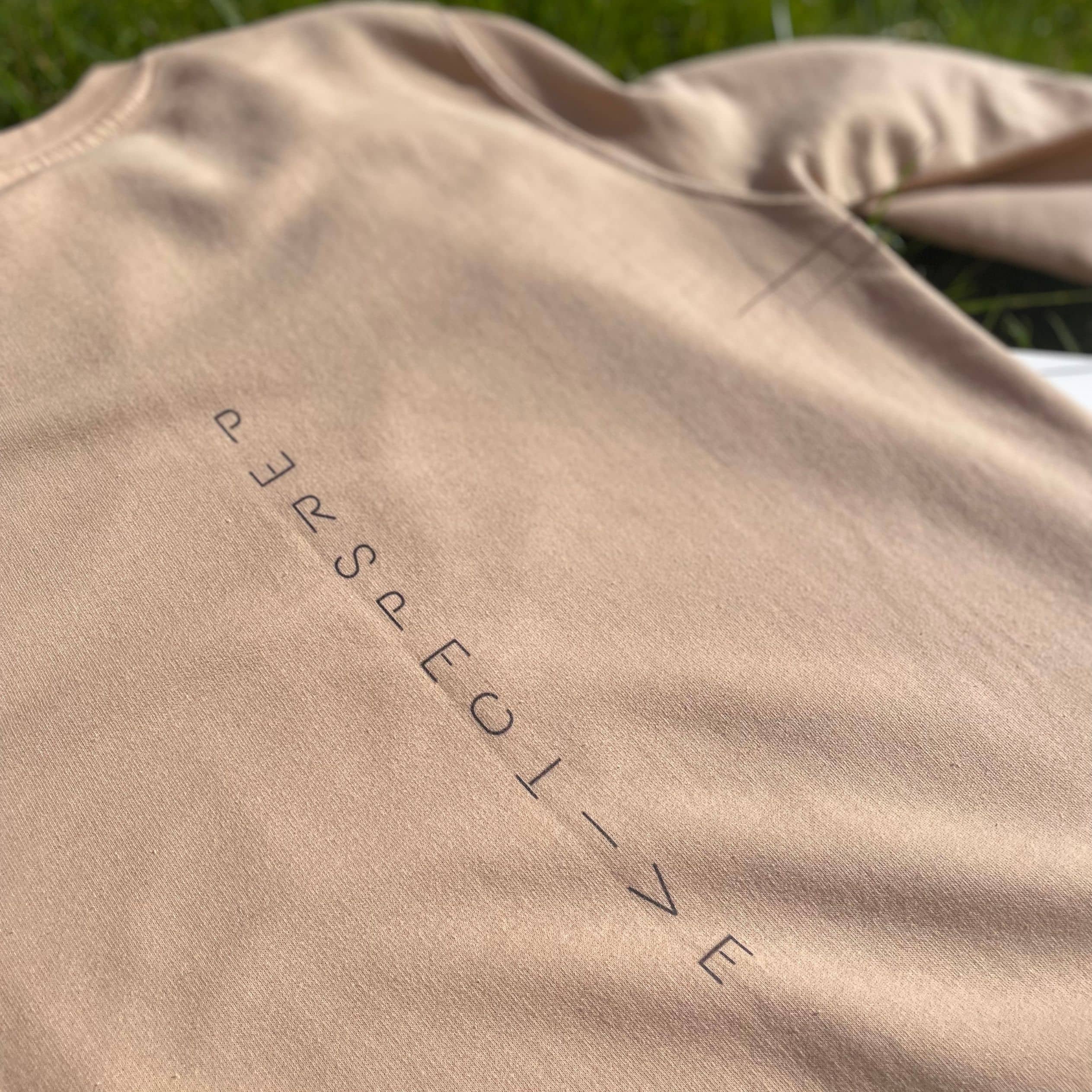 Sweatshirt with "perspective" down the back of the jumper. Letters in the word of perspective are tilted to give perspective to the word perspective