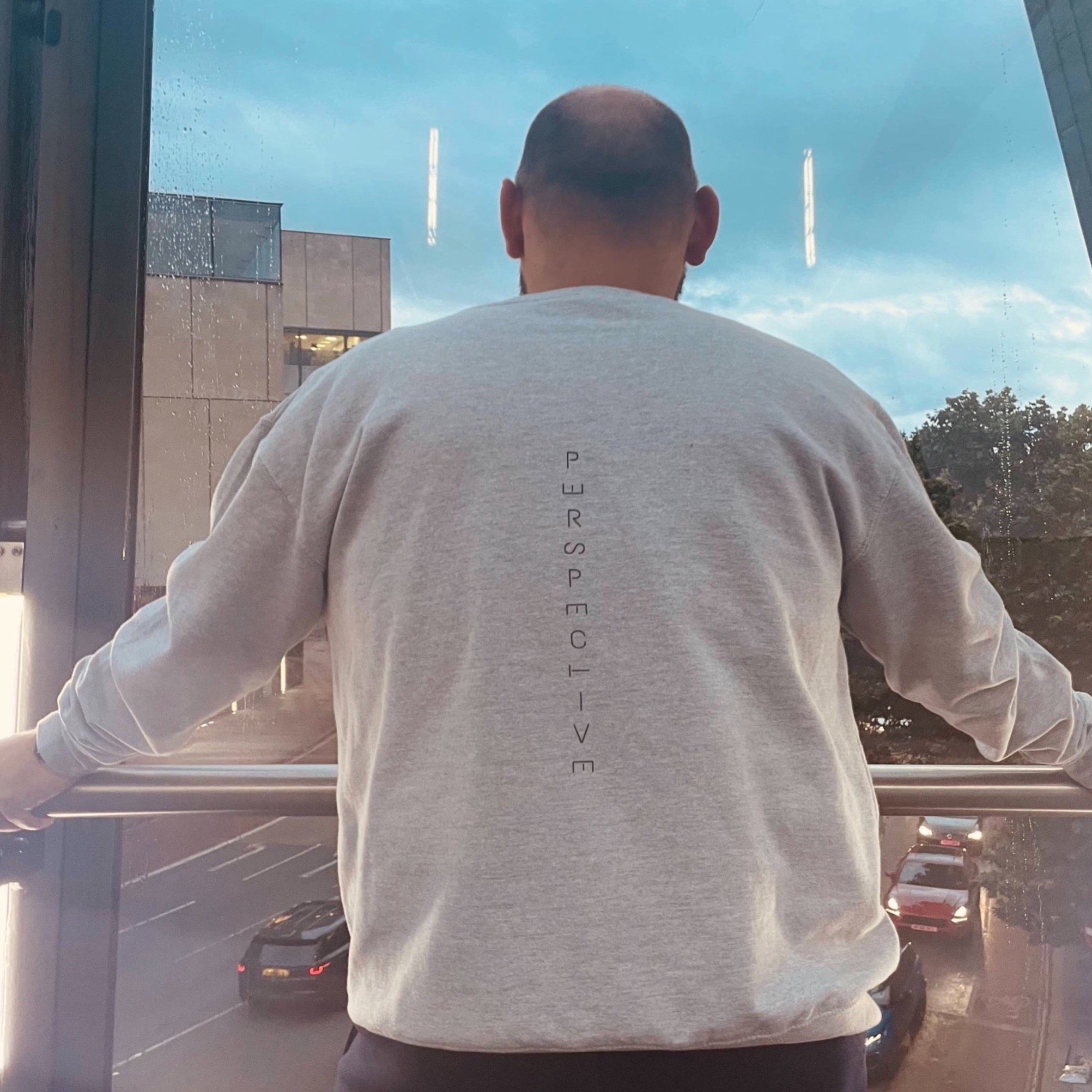 Sweatshirt with "perspective" down the back of the jumper. Letters in the word of perspective are tilted to give perspective to the word perspective