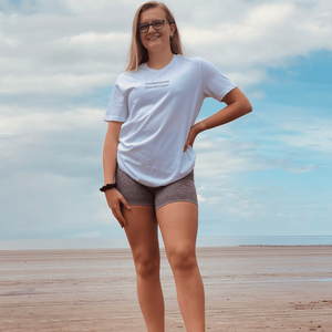 Arctic White Organic T-Shirt that reads professional overthinker in a typewriter style font. Professional Thinker takes up the middle section of the chest and is a small style size to not take up to much of the t-shirt