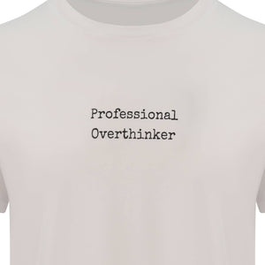 Arctic White Organic T-Shirt that reads professional overthinker in a typewriter style font. Professional Thinker takes up the middle section of the chest and is a small style size to not take up to much of the t-shirt