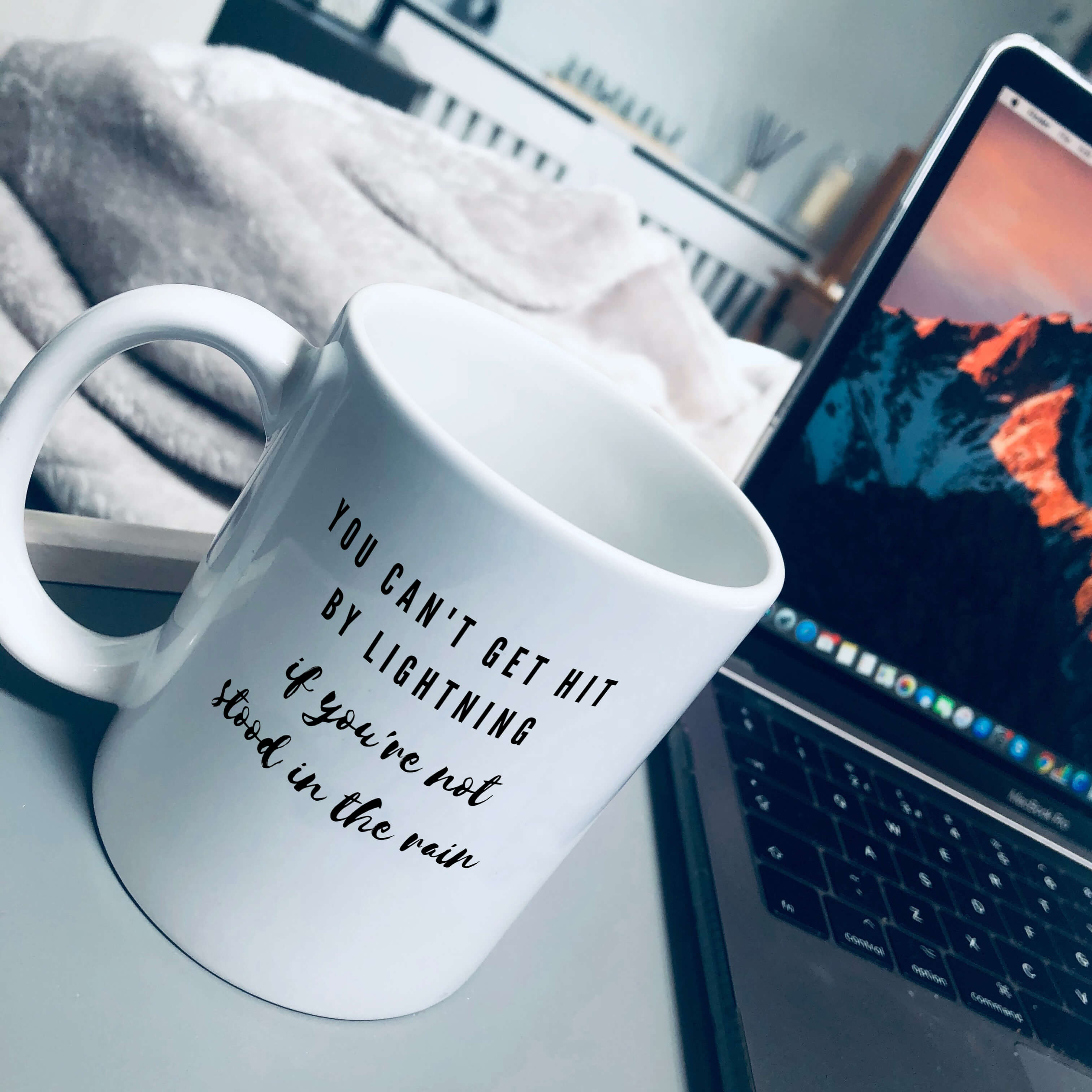 Mug that says: You can't get hit by lightning if you're not stood in the rain
