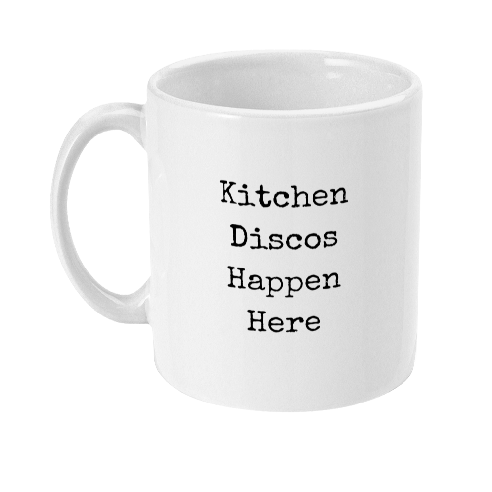 Mug with text on in type writer font that says: Kitchen discos happen here