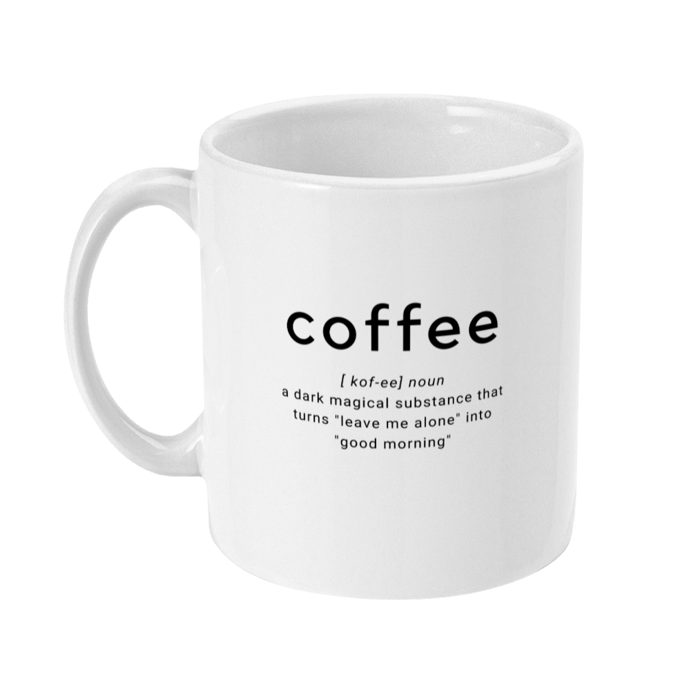 Coffee mug. Mug has coffee in larger text, with text underneath that says: a dark magical substance that turns leave me alone into good morning