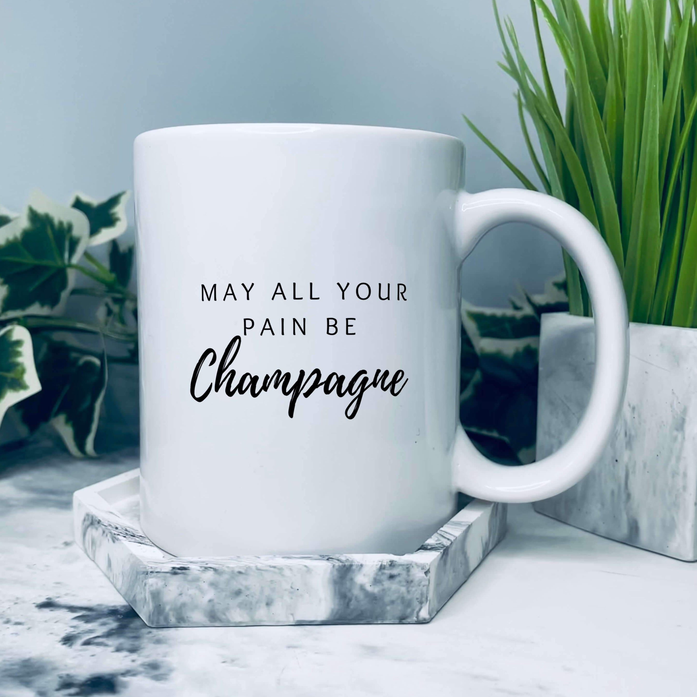 Mug that says: May all your pain be champagne 