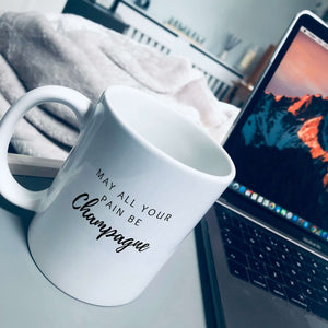 Mug that says: May all your pain be champagne 