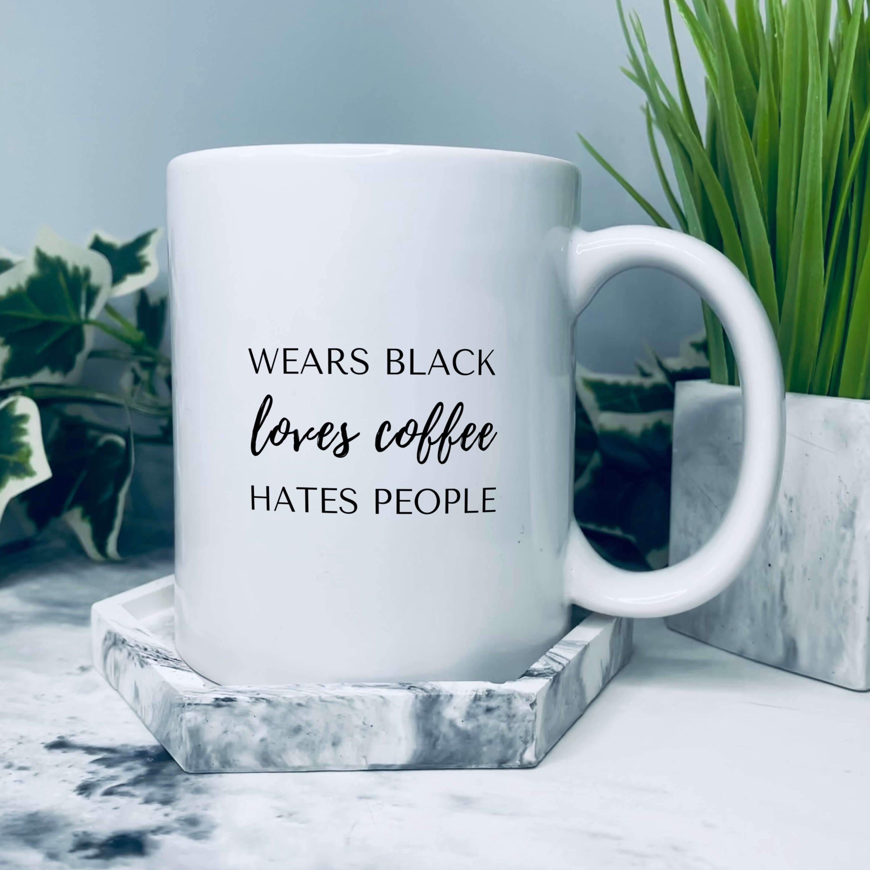 Mug that says: wears black, loves coffee, hates people